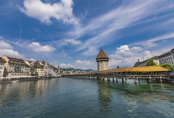 Fototapeta na wymiar Chapel bridge and Water tower on Reuss river in Lucerne