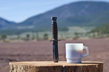 K bar knife and the coffee cup