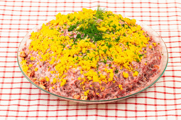 Traditional russian layered salad named herring under a fur coat.