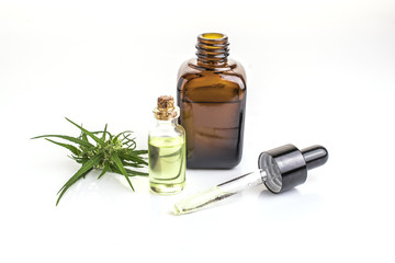 cannabis essential oil container with cannabis leaves