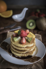 Buckwheat pancakes with berry fruit and honey.