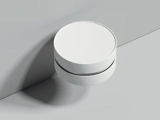 White realistic round box next to the grey wall. 3d rendering