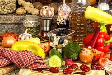 Preparation of vegetable salad in the kitchen. Fresh vegetables on a kitchen board. Healthy diet food.