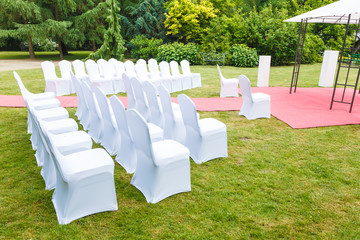 Many wedding chairs with white elegant covers
