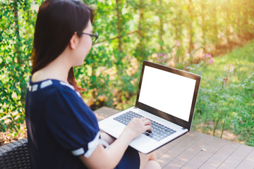 Business Asian woman working with laptop computer on office outdoor.