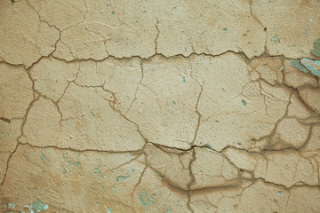 Texture light plastered wall with cracks