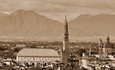 city in Italy and the famous monument called BASILICA PALLADIANA with sepia toned effect