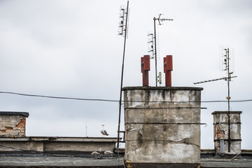Roof with antennas and chimneys