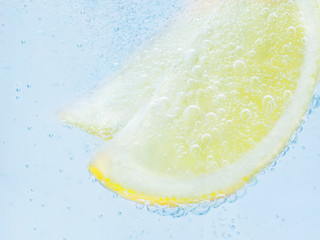 slices of fresh juicy yellow lemon drop soda.