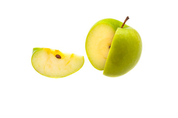 A single slice of a large green apple was cut off. On a white background.