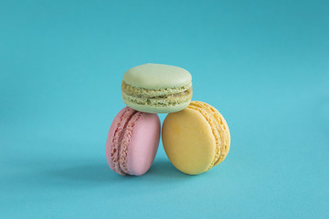 Traditional french macaroons on blue background