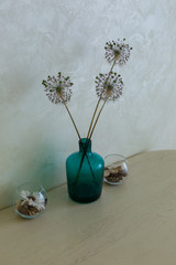 blue vase on the kitchen table. vase of flowers. kitchen interior