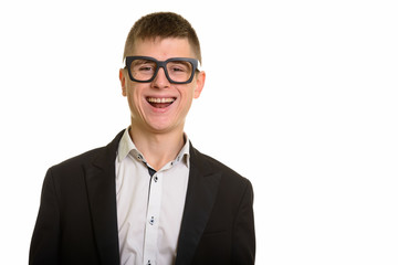 Studio shot of young happy businessman smiling and laughing