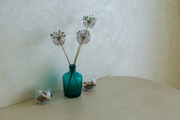 blue vase on the kitchen table. vase of flowers. kitchen interior