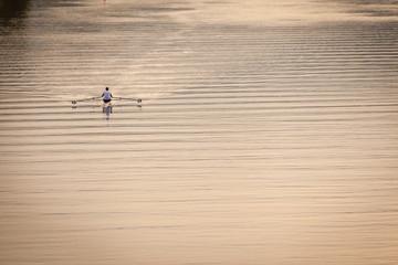 a person kayaking on sunny morning on the river Necker in Heidelberg, Germany