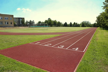 Numbered start track in stadium. Start line with numbers and lanes on running track.