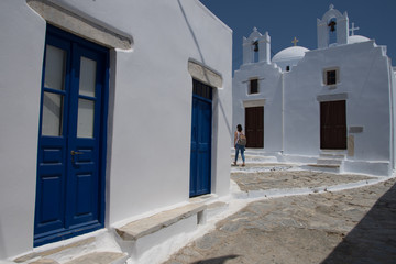 Fototapeta na wymiar Amorgos,Greece-August 4 ,2017through the narrow streets and the multicolored doors leading to the castle of Chora in Amorgos
