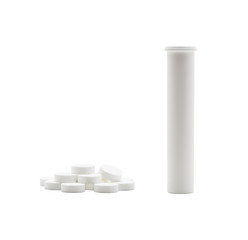 The stack of soluble tablets beside is the open tube, on white background with clipping path.