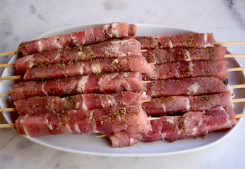 Raw pork meat isolated on white background.Close up of raw pork skewers