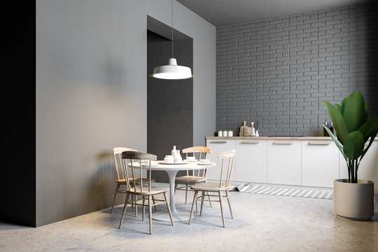Small gray brick kitchen and dining room corner