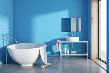 Fototapeta na wymiar Round bathtub blue bathroom interior