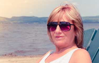 60 years old woman on vacation portrait