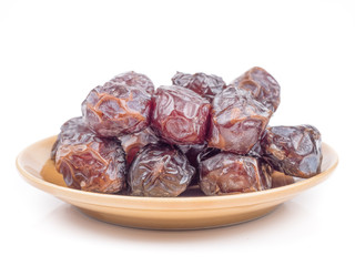 close up shot on dates, sweet dried fruits on white background
