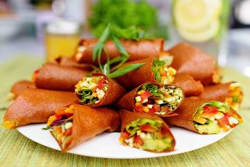 Raw food vegan wraps filled with veggies on a plate