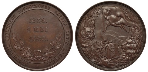 Dutch commemorative medal 50th Anniversary of royal zoological society, dates in center, branches below, wildlife, elephant, lion, leopard, jungle, mountains behind, bronze,