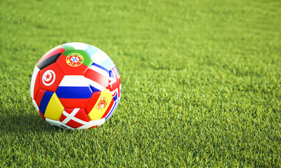 Plakat Soccer ball on green grass
