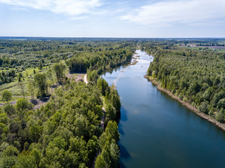 drone image. aerial view of rural area lake in forest with green water
