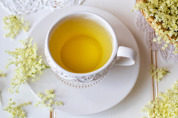 Obraz na płótnie Canvas A cup of tea with fresh elder flowers