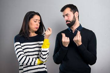 Ruined couple on grey background