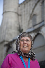 senior tourist outside mosque