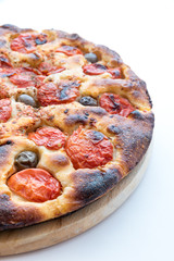 Focaccia typical of Bari Italy with tomatoes and olive