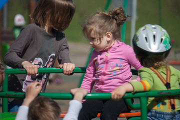 Little girl on the carousel