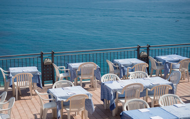 Restaurant on a terrace overlooking the sea.