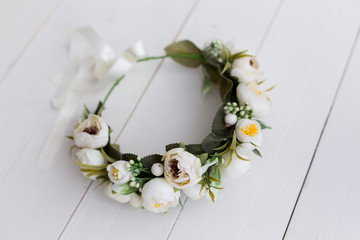 wreath of flowers. wreath of white roses. the decoration on the head