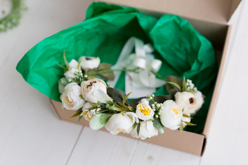 wreath of flowers. wreath of white roses. decoration on the head. a wreath lies in a box