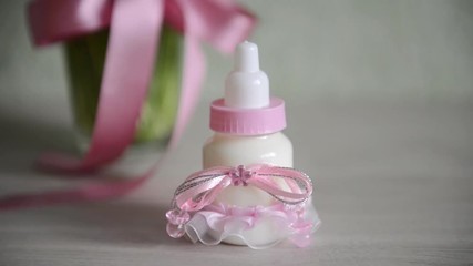 decorative baby bottle with milk are on the table. For a baby shower celebrate. for thematic birthday decor
