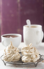 Coffee meringues with chocolate sauce