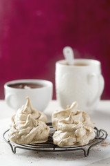 Coffee meringues with chocolate sauce