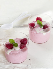 Raspberry mousse with cream, raspberries and mint 