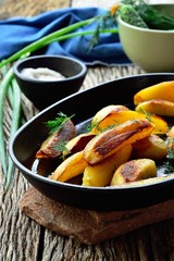 Fried potatoes in  cast iron pan