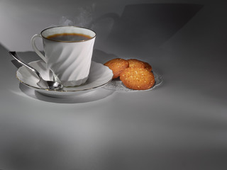 Cup of hot coffee and cookies