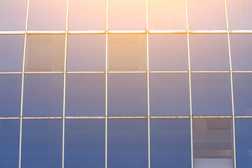 The glass surface of the house, reflecting the rays of sunny, modern architecture