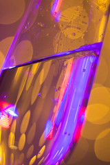 Champagne glass in disco party bar