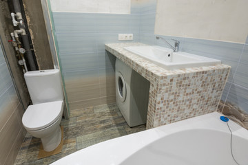 Unfinished repairs in the bathroom, a pedestal under the washbasin, under which there is a washing...