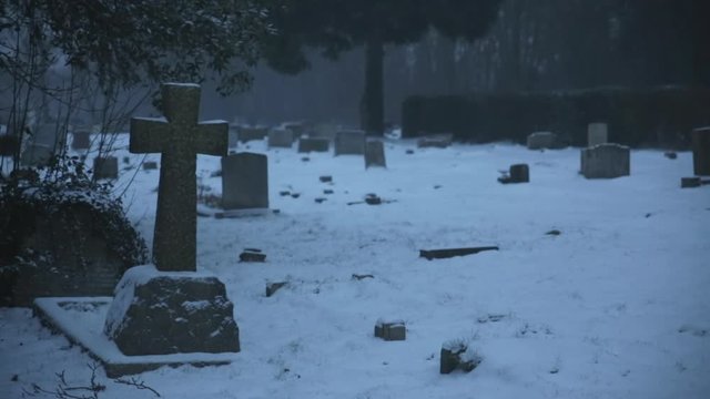 Grave in the snow (Cross) in England