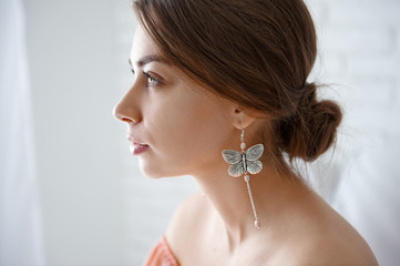 portrait of a beautiful woman with earrings close-up